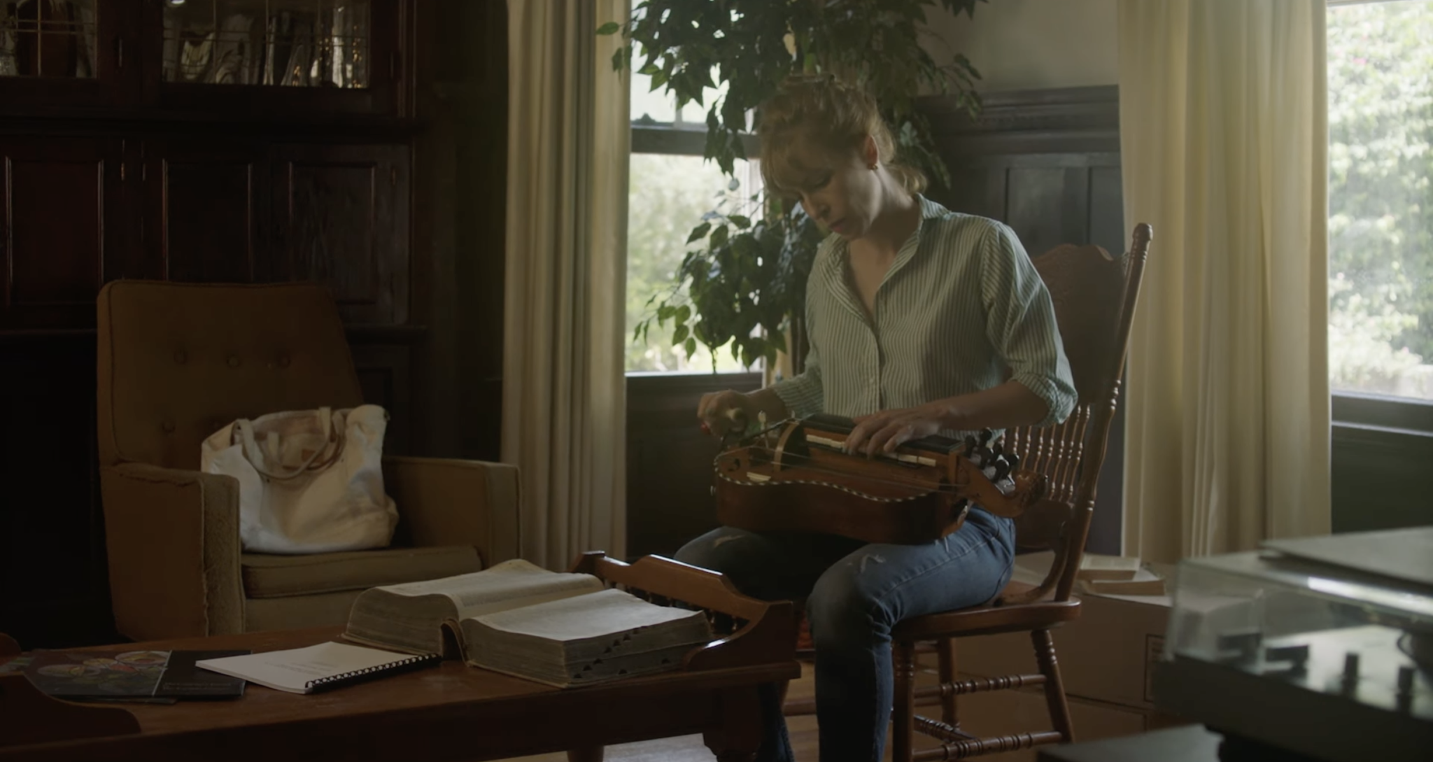 Cas plays a hurdy gurdy